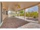 Spacious covered patio with brick flooring, offering an ideal outdoor entertaining area at 7908 Morning Gallop Ct, Las Vegas, NV 89131