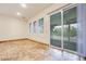 Sun room featuring sliding glass doors with exterior view, plus three windows at 7908 Morning Gallop Ct, Las Vegas, NV 89131