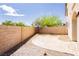 Backyard features a decorative stone patio and privacy wall at 8224 Cassis Ct, Las Vegas, NV 89117