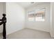 Neutral bedroom with carpeted flooring and a bright window view at 8224 Cassis Ct, Las Vegas, NV 89117