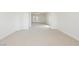 Large bedroom featuring neutral carpet and double doors to a balcony at 8224 Cassis Ct, Las Vegas, NV 89117