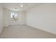 Spacious bedroom with carpet, ceiling fan, and a large window for natural light at 8224 Cassis Ct, Las Vegas, NV 89117