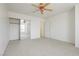 Light filled bedroom with ceiling fan and large mirrored closet at 8224 Cassis Ct, Las Vegas, NV 89117