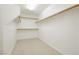 Walk-in closet with carpet flooring and wood shelving at 8224 Cassis Ct, Las Vegas, NV 89117