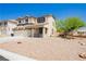 Attractive two-story home with stucco exterior, covered porch, and low maintenance gravel front yard at 8224 Cassis Ct, Las Vegas, NV 89117