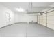 Spacious three-car garage features bright lighting and epoxy flooring at 8224 Cassis Ct, Las Vegas, NV 89117