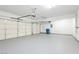 Spacious three-car garage features bright lighting and epoxy flooring at 8224 Cassis Ct, Las Vegas, NV 89117
