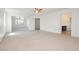 Open main bedroom featuring large carpeted area, bathroom, and walk-in closet at 8224 Cassis Ct, Las Vegas, NV 89117