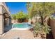 Backyard features a pool, spa, patio and desert landscaping at 8224 Cassis Ct, Las Vegas, NV 89117