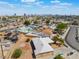Aerial view of home, desert landscaping, fenced yard, and skyline at 829 Dover Pl, Las Vegas, NV 89107