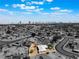 Aerial view of property highlighting its location in a neighborhood with the city skyline in the background at 829 Dover Pl, Las Vegas, NV 89107