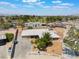 Aerial view of home with desert landscaping, fenced yard, and city views at 829 Dover Pl, Las Vegas, NV 89107