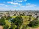 Aerial view of community highlighting a park setting near the property and a stunning Las Vegas skyline at 829 Dover Pl, Las Vegas, NV 89107