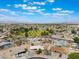 An aerial view reveals a community setting and a house featuring a circular driveway, and desert landscaping at 829 Dover Pl, Las Vegas, NV 89107