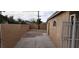 Enclosed backyard featuring brick and concrete pavers, ideal for customization at 829 Dover Pl, Las Vegas, NV 89107