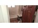 Cozy bathroom featuring a shower-tub combo, convenient grab bar, and classic white tile at 829 Dover Pl, Las Vegas, NV 89107