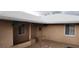 Exterior shot of the home's entrance featuring desert landscaping, hanging plants, and muted exterior color at 829 Dover Pl, Las Vegas, NV 89107