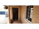 Exterior image of the property showing an entryway with a window and a doorway to the interior of the home at 829 Dover Pl, Las Vegas, NV 89107
