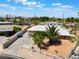 Inviting exterior of a single-story home with a private yard, palm tree, decorative fence, and desert landscaping at 829 Dover Pl, Las Vegas, NV 89107