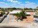 Inviting exterior of a single-story home with a private yard, palm tree, decorative fence, and desert landscaping at 829 Dover Pl, Las Vegas, NV 89107