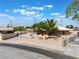 Charming single-story home featuring a well-maintained yard with a white decorative fence and stucco walls at 829 Dover Pl, Las Vegas, NV 89107