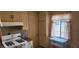 Functional kitchen with classic cabinetry, gas range, and a window providing natural light at 829 Dover Pl, Las Vegas, NV 89107