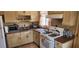 Functional kitchen featuring a stainless steel sink, and gas range, classic cabinetry with ample counter space at 829 Dover Pl, Las Vegas, NV 89107