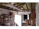 Storage room filled with boxes and household goods, with wood beams and a fluorescent light at 829 Dover Pl, Las Vegas, NV 89107