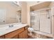 Bathroom features a single sink vanity, and sliding glass doors enclosing a stand up shower at 830 Carnegie St # 824, Henderson, NV 89052
