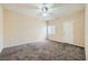 Cozy bedroom with carpet, ceiling fan, and natural light from the window at 830 Carnegie St # 824, Henderson, NV 89052