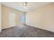 Bedroom with neutral walls, ceiling fan, and a single window at 830 Carnegie St # 824, Henderson, NV 89052
