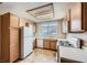 Well-lit kitchen features white appliances, gas range, and ample cabinet storage at 830 Carnegie St # 824, Henderson, NV 89052