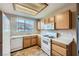 Bright kitchen with white appliances, gas range, and lots of natural light at 830 Carnegie St # 824, Henderson, NV 89052