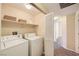 Functional laundry room equipped with a washer and dryer for convenient laundry care at 830 Carnegie St # 824, Henderson, NV 89052