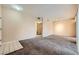 Open-concept living room with tile entryway and plush carpeting at 830 Carnegie St # 824, Henderson, NV 89052