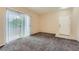 Bright room with sliding glass doors and carpet flooring at 830 Carnegie St # 824, Henderson, NV 89052