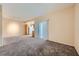 Spacious living room featuring neutral walls and plush carpeting at 830 Carnegie St # 824, Henderson, NV 89052