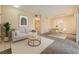 Comfortable living area with a sofa, coffee table, and dining set, perfect for relaxing and entertaining at 830 Carnegie St # 824, Henderson, NV 89052