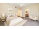 A bright bedroom with a queen sized bed and ensuite bathroom at 830 Carnegie St # 824, Henderson, NV 89052