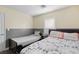 Bedroom with two beds, wood flooring, and natural light at 8336 Golden Amber St, Las Vegas, NV 89139