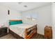 Bedroom features queen-size bed, dark wood nightstand, and closet at 8336 Golden Amber St, Las Vegas, NV 89139