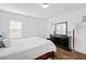 Bedroom featuring hardwood floors, natural light, neutral colors and a dresser with mirror at 8336 Golden Amber St, Las Vegas, NV 89139
