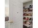 Walk-in closet with shelves storing shoes and more at 8336 Golden Amber St, Las Vegas, NV 89139