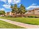 Manicured green spaces in the community surround well-maintained neighborhood homes at 8336 Golden Amber St, Las Vegas, NV 89139