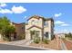Inviting two-story home with a terra cotta tile roof and desert landscaping in the front yard at 8336 Golden Amber St, Las Vegas, NV 89139