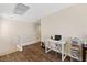 Upstairs landing area featuring hardwood floors, stairway with white banister, and natural light at 8336 Golden Amber St, Las Vegas, NV 89139
