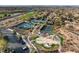 Aerial view of tennis courts and the playground area, surrounded by lush green landscaping at 9 Knob Oak Dr, Henderson, NV 89052