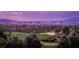 Scenic community view with golf course and Las Vegas skyline at dusk at 9 Knob Oak Dr, Henderson, NV 89052