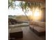 A backyard patio offers a view of the lovely rock waterfall and the putting green at 9 Knob Oak Dr, Henderson, NV 89052
