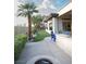 Beautiful backyard features a putting green, desert landscaping, and a built-in fire pit with seating at 9 Knob Oak Dr, Henderson, NV 89052